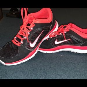 Pink and black nike shoes worn